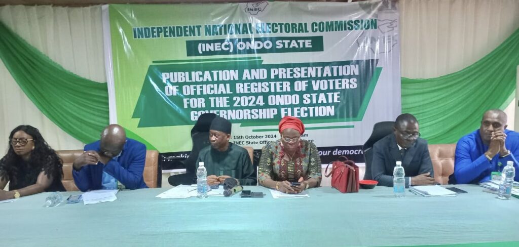 A photo of INEC officials presenting the official register of voters for the 2023 Ondo State Governorship election.