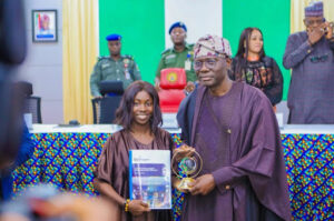 Itunuoluwa Soniregun with the Governor of Lagos State.