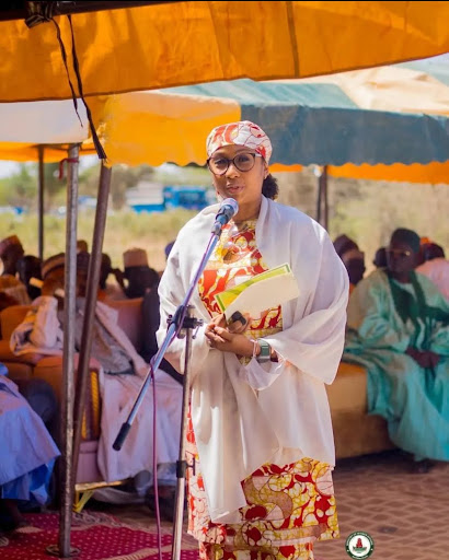 Hadiza Yaradua in an attire speaking to people.