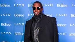 Diddy in a black Coat