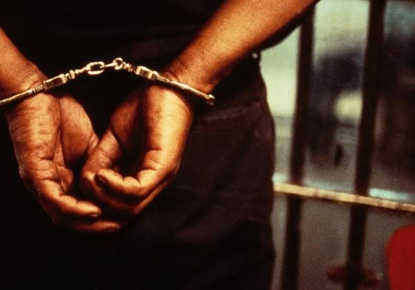 Man in handcuffs. Photo source: Nigeria stories