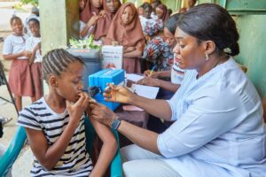Young Girl getting immunised. Photo credit: Web