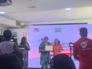 Naija Feminists Media Founding Director, Simbiat Bakare, Receiving the Award on Behalf of the Organisation.
