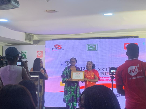Naija Feminists Media Founding Director, Simbiat Bakare, Receiving the Award on Behalf of the Organisation.