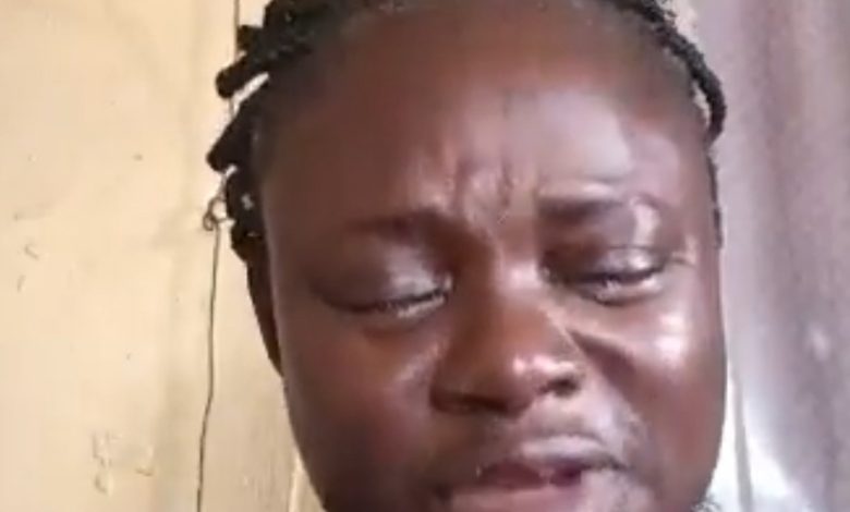 Screenshot from video of the woman weeping bitterly