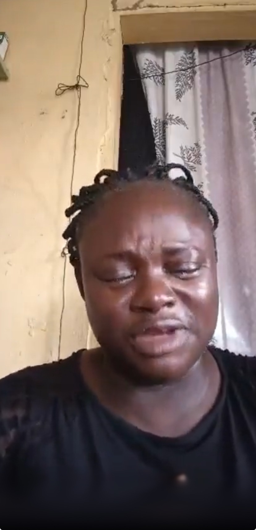 Screenshot from video of the woman weeping bitterly
