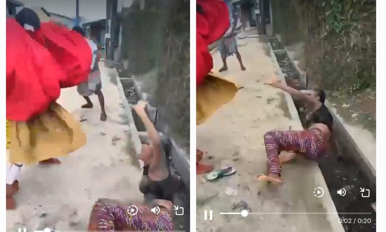 Picture of the woman being beaten by masquerade. Photo credit: SaharaReporters on X