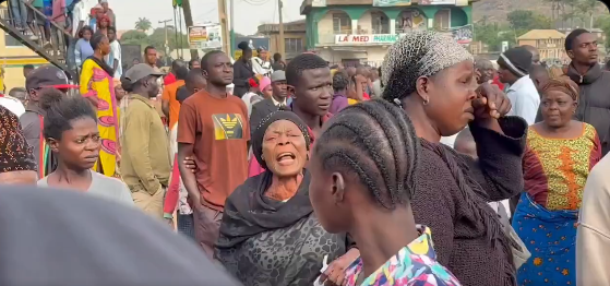 Screenshot from viral video of elderly women crying out